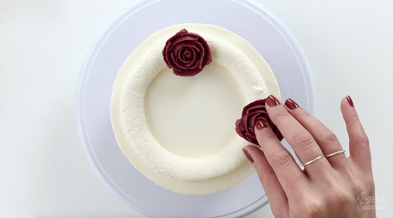 how to arrange buttercream flowers on cake