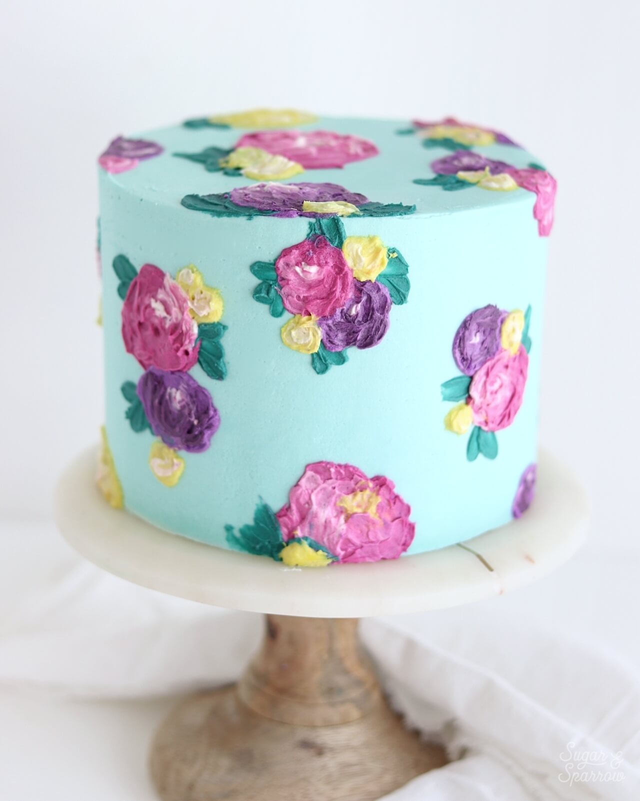 painted buttercream cake with flowers