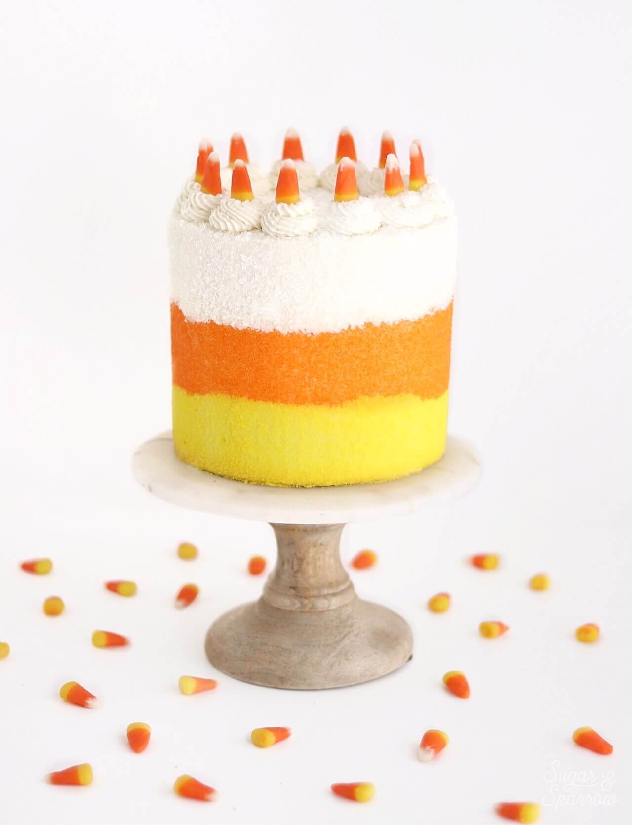 candy corn halloween party cake by sugar and sparrow