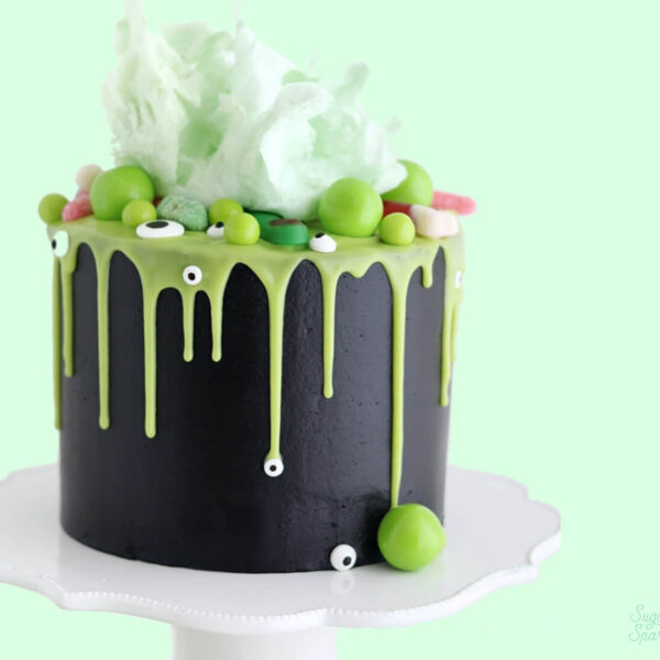 halloween witch cauldron cake by sugar and sparrow