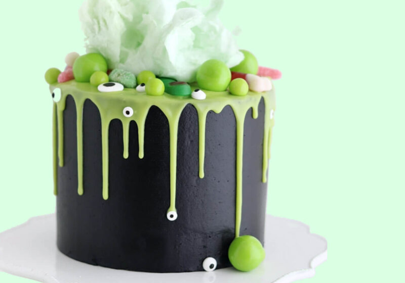 halloween witch cauldron cake by sugar and sparrow