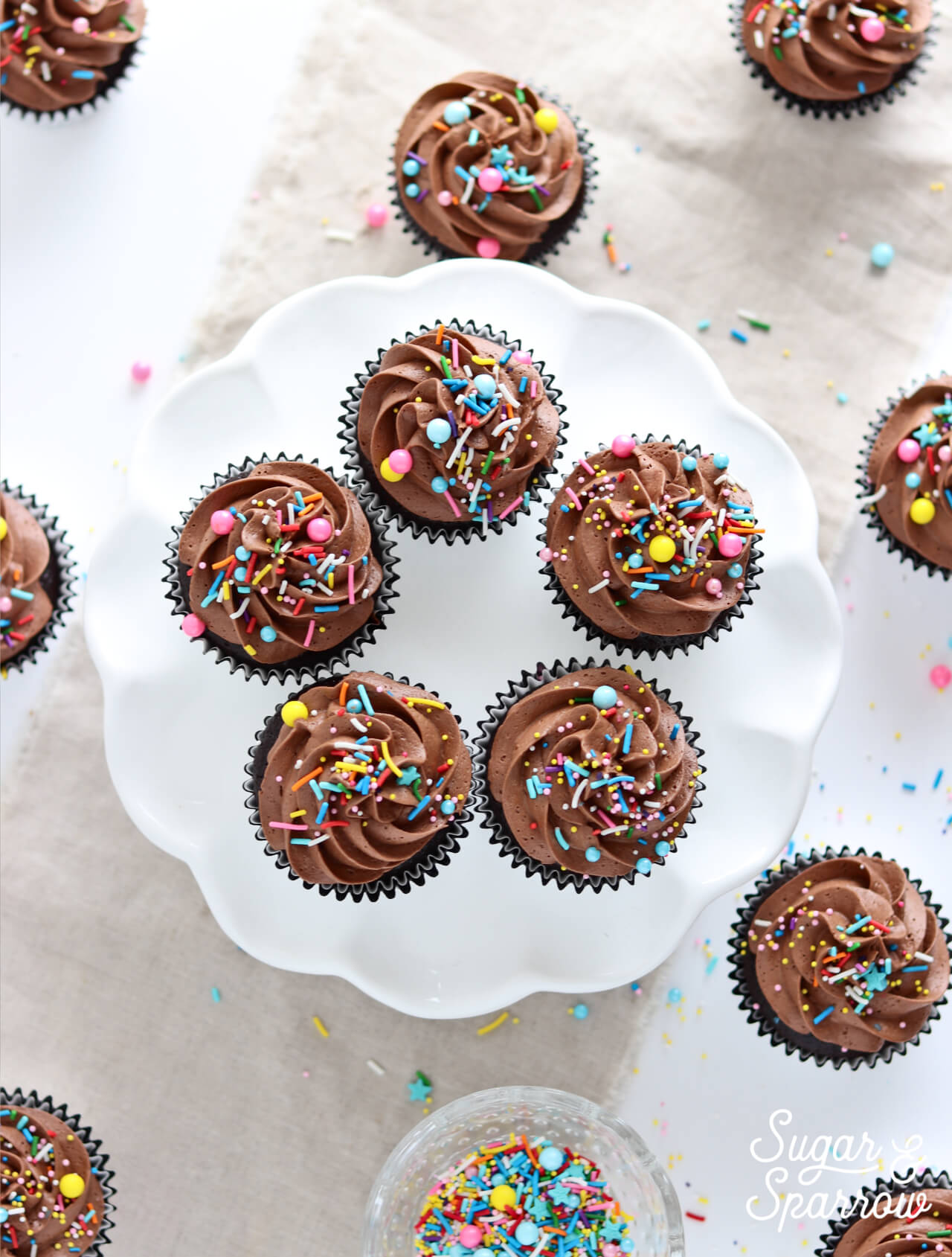 chocolate cupcakes with chocolate buttercream by sugar and sparrow