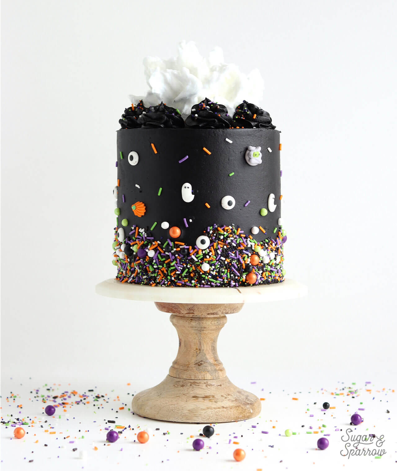 halloween cake with black buttercream and sprinkles