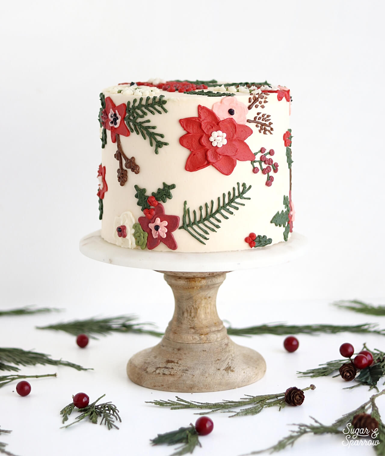 christmas floral cake by sugar and sparrow