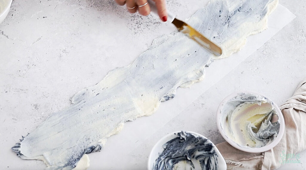 smoothing buttercream on parchment