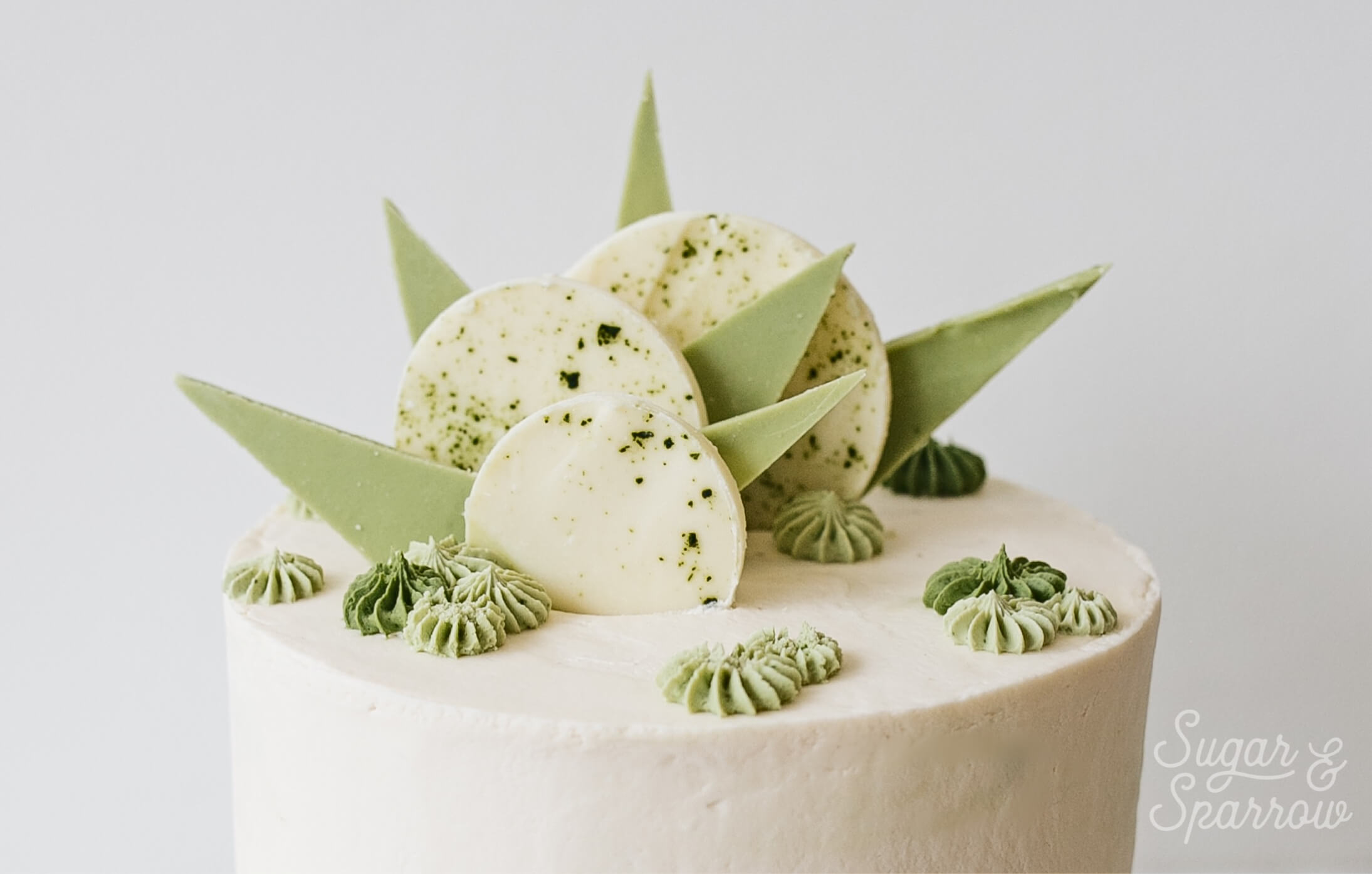 white chocolate matcha cake by sugar and sparrow