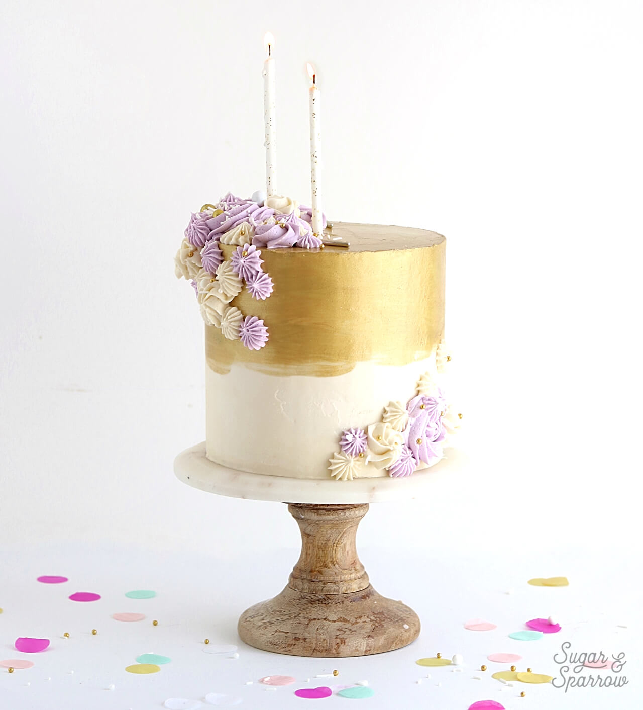 metallic gold buttercream cake by sugar and sparrow