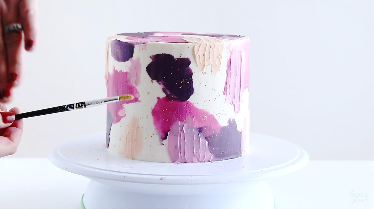 splatter painted cake by sugar and sparrow