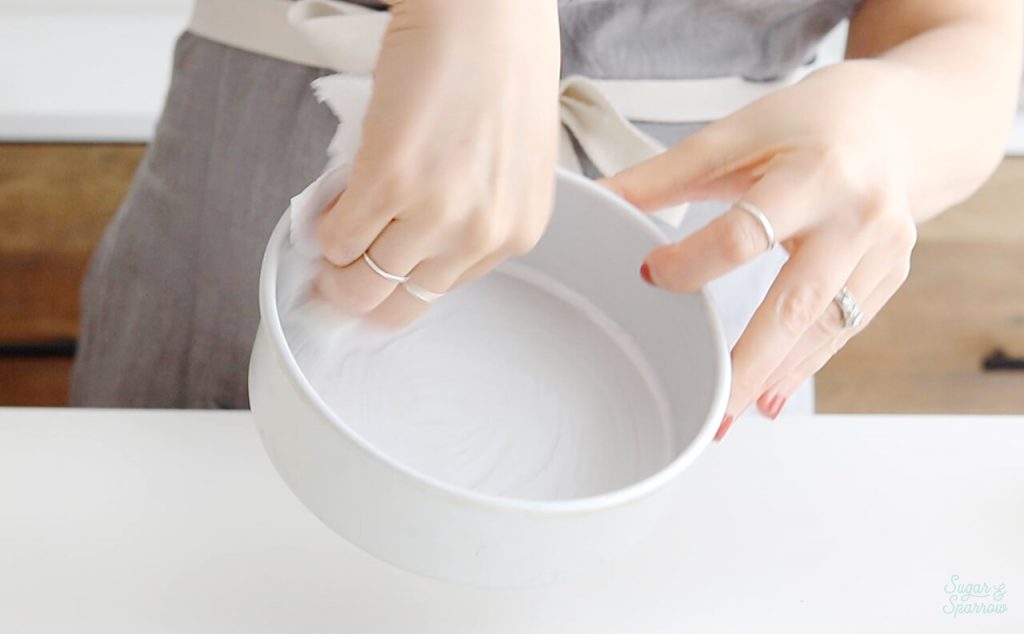 greasing a cake pan