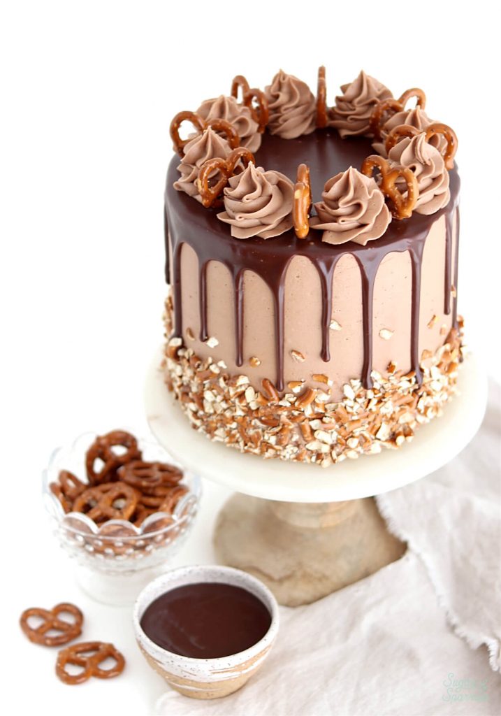 pretzel cake recipe with nutella buttercream and nutella ganache drip cake