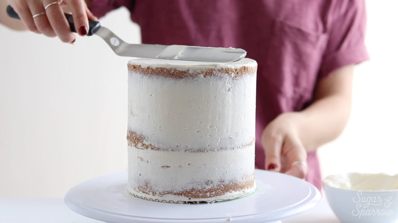 how to crumb coat a cake by sugar and sparrow