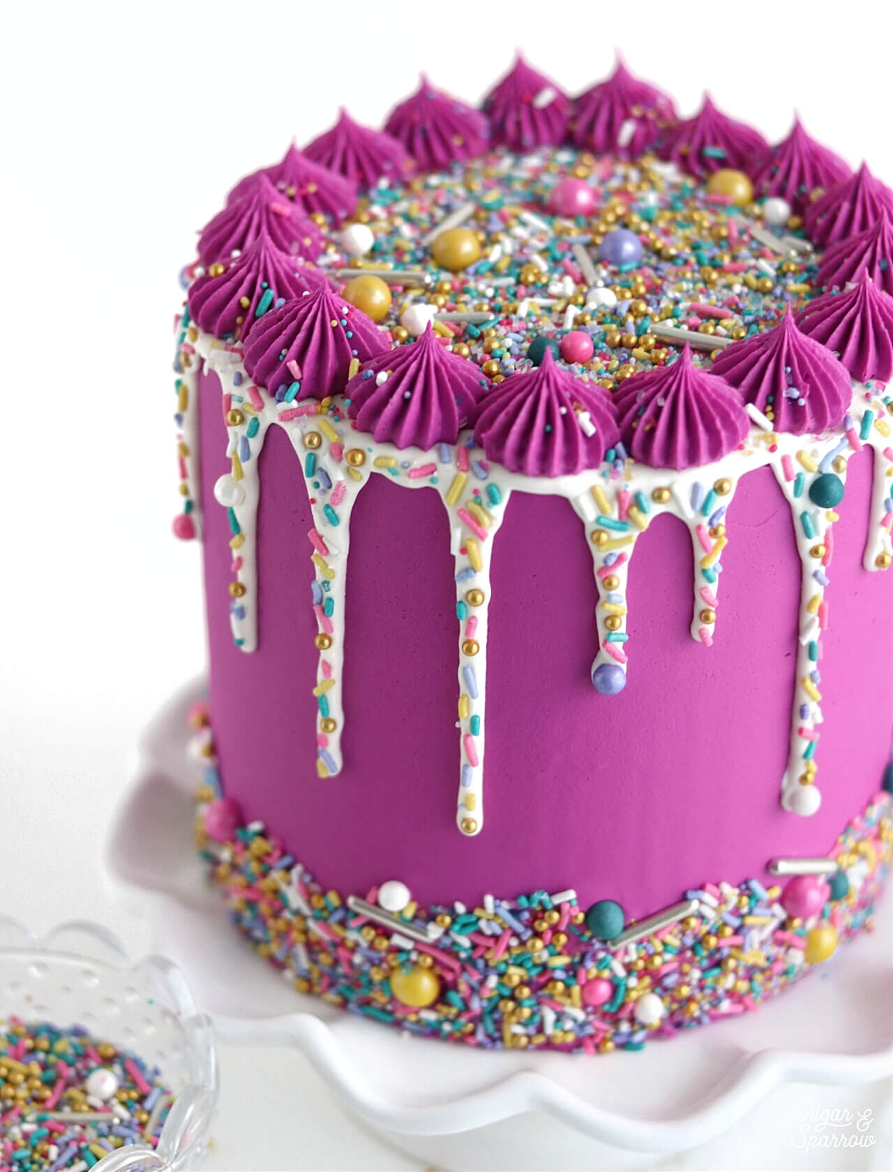 sprinkle drip cake by sugar and sparrow