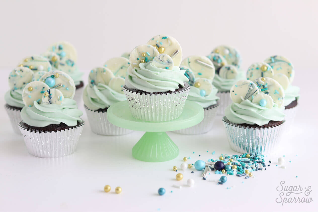 sprinkled white chocolate cupcakes by sugar and sparrow