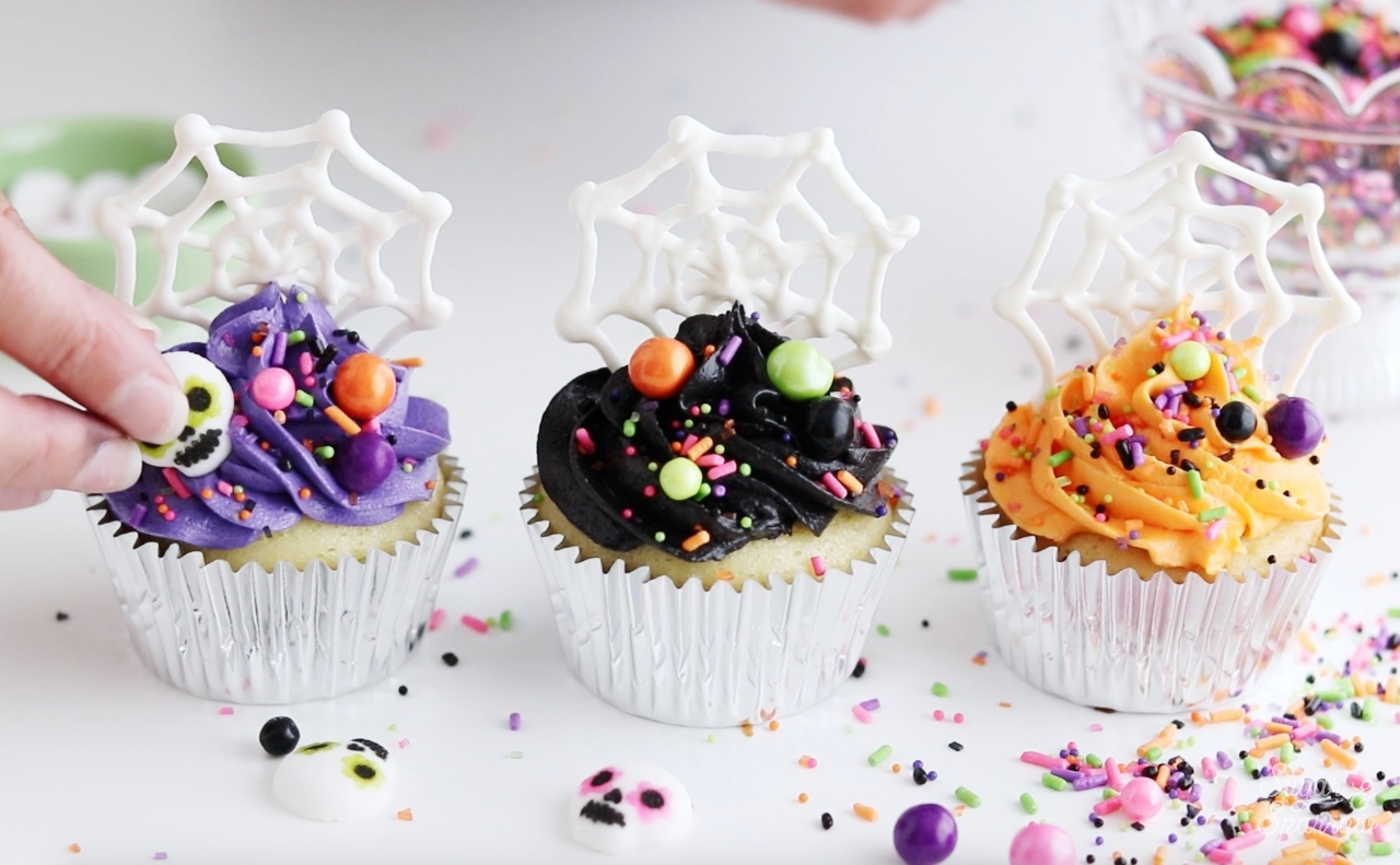Halloween cupcakes with spiderwebs and sprinkles