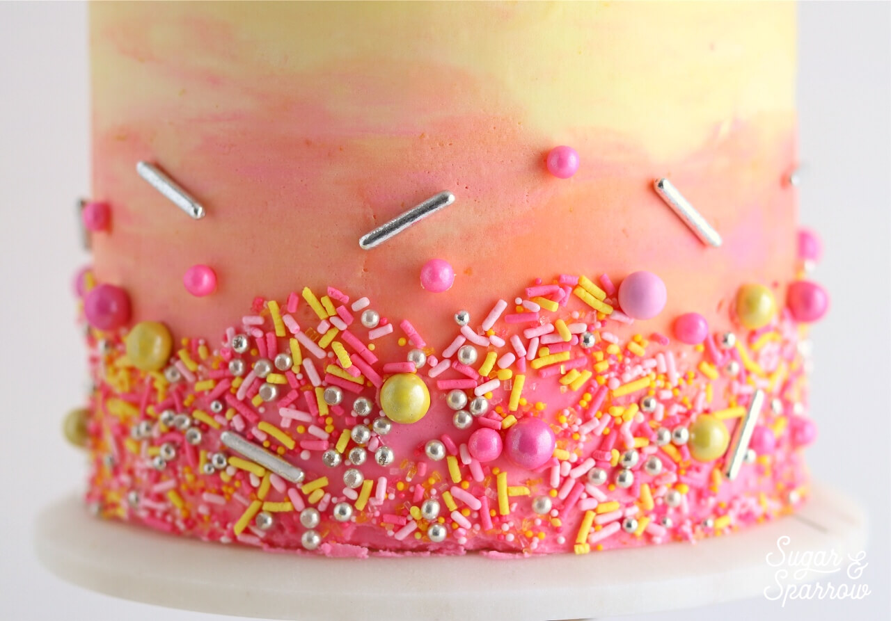 Colorful cake with sprinkles by sugar and sparrow