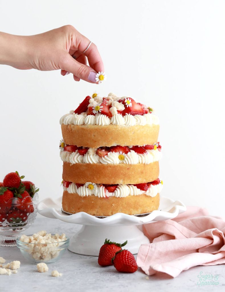 strawberry cake with chamomile flowers by sugar and sparrow