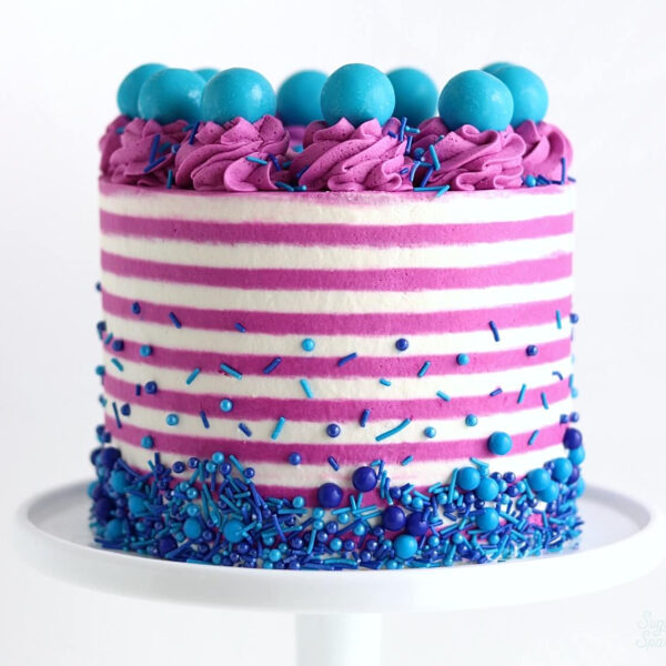 striped buttercream cake by sugar and sparrow