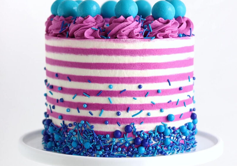 striped buttercream cake by sugar and sparrow