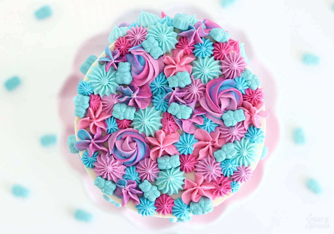 pink and blue cake by sugar and sparrow