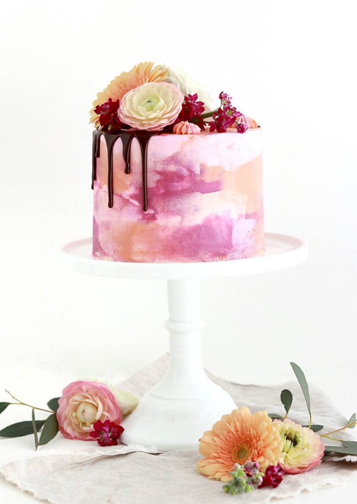 watercolor cake with drip and flowers