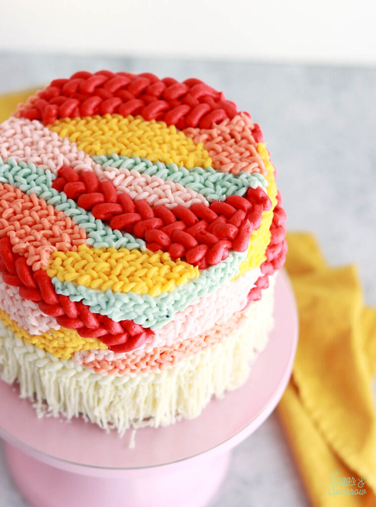 woven tapestry wall hanging buttercream cake