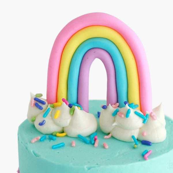 rainbow cake topper by sugar and sparrow
