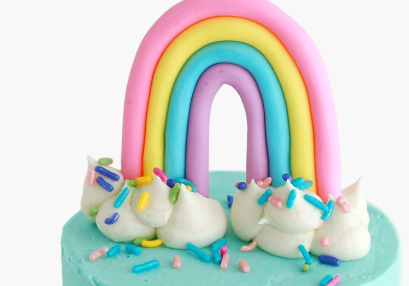 rainbow cake topper by sugar and sparrow
